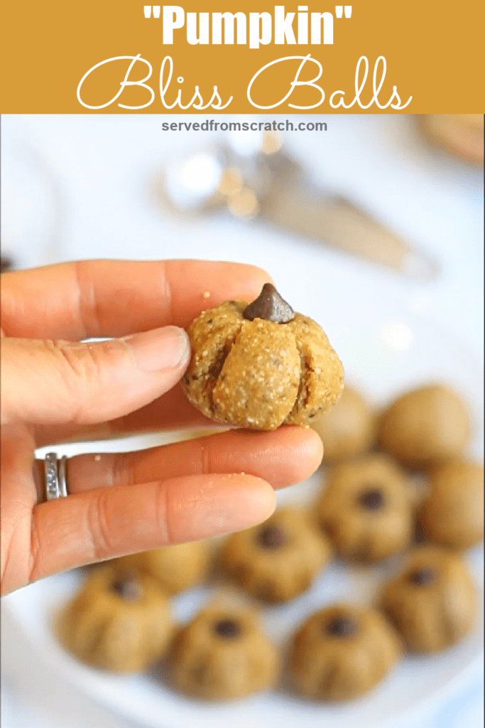 a hand holding a pumpkin shaped bliss ball with Pinterest pin text.