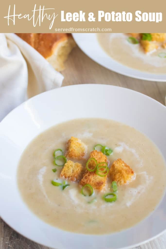 a bowl of leek and potato soup with croutons and green onions with pinterest pin text.