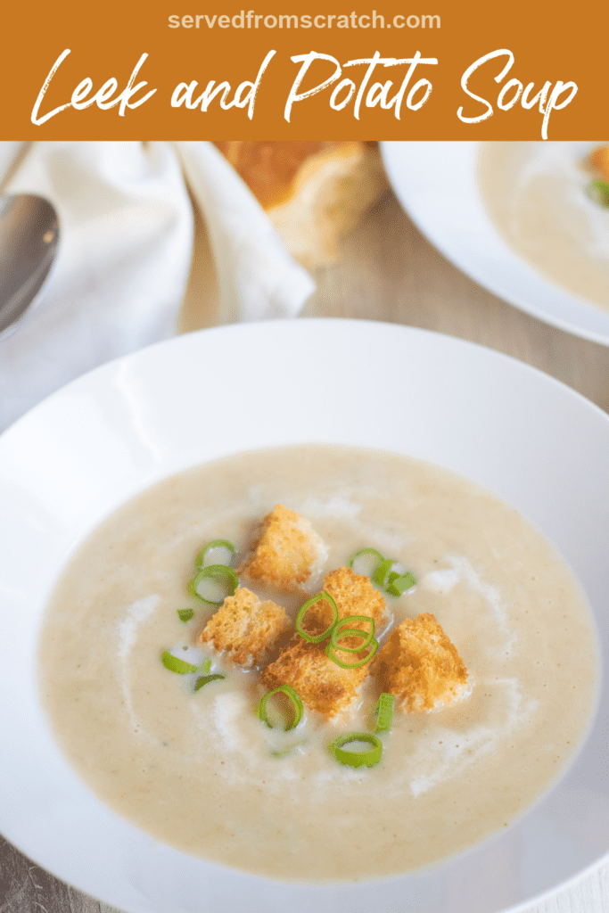 a bowl of creamy soup with croutons and onions and Pinterest pin text.