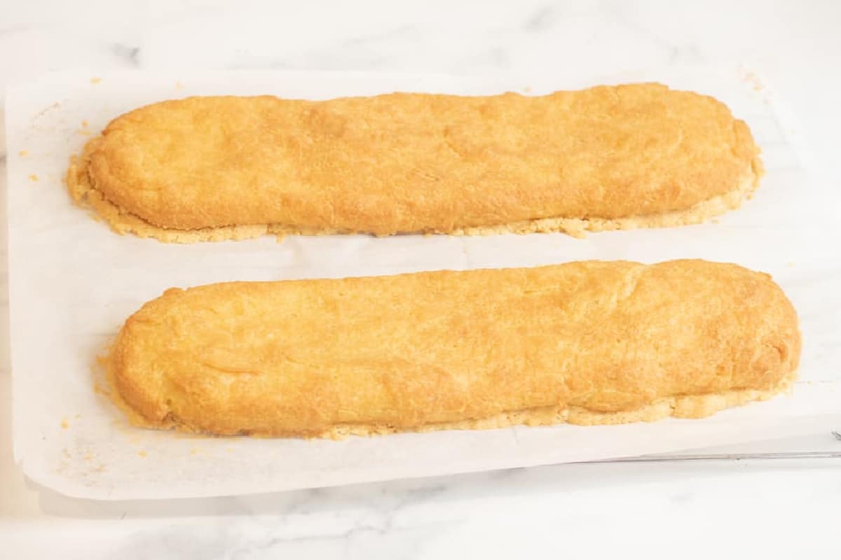 two baked puff pastries on parchment paper.
