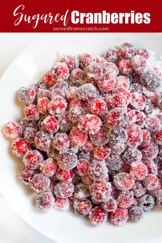 a bowl of sugared cranberries with Pinterest pin text.