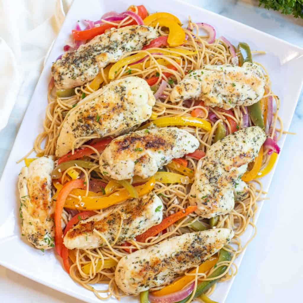 an overhead of a large platter of chicken scampi.