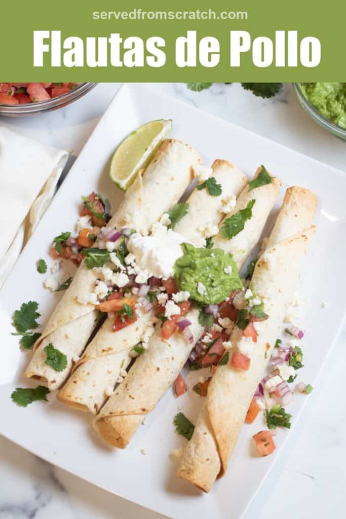 baked flautas on a plate topped with pico, guac, and sour cream with Pinterest pin text.