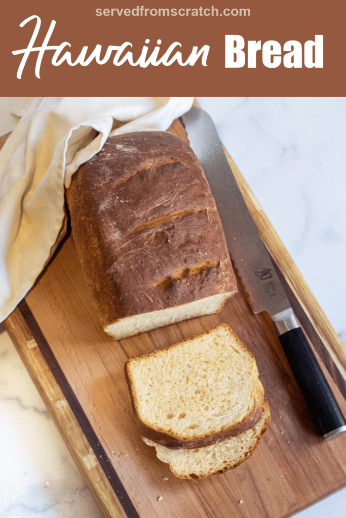 a loaf and sliced bread on a board with Pinterest pin text.