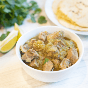 a bowl of pork in green chili.