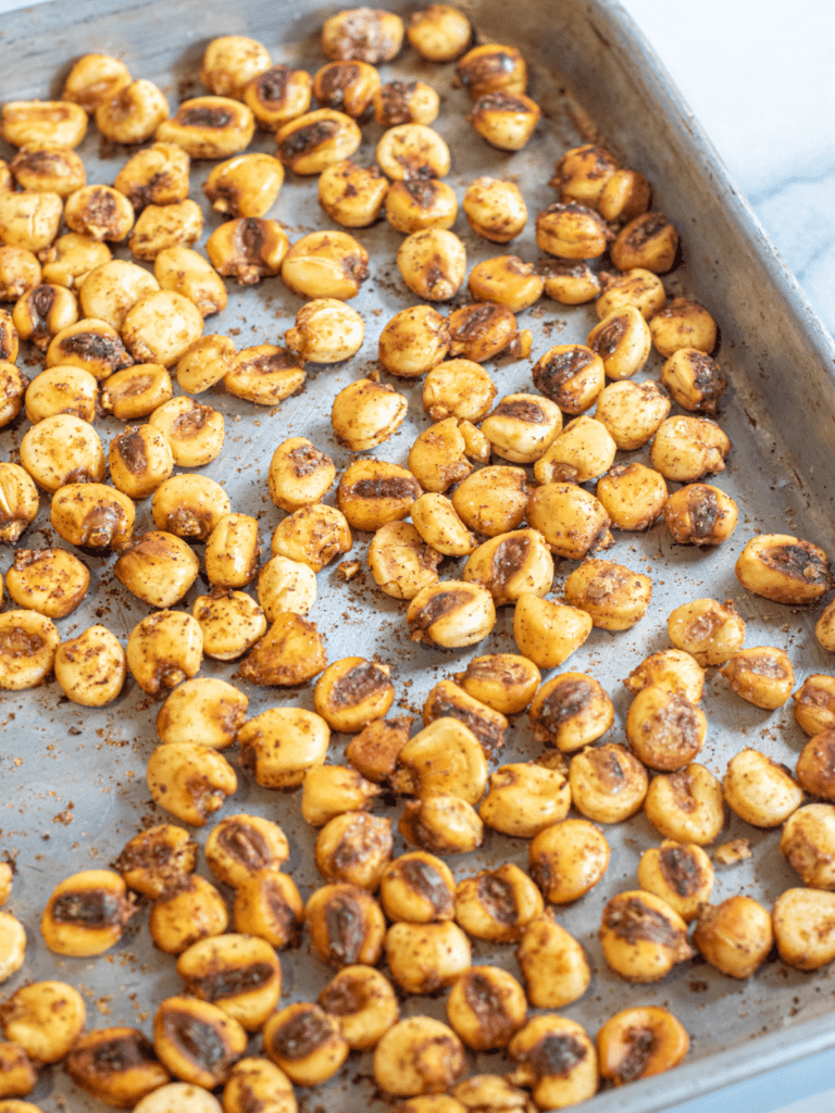 roasted corn nuts on a baking tray.