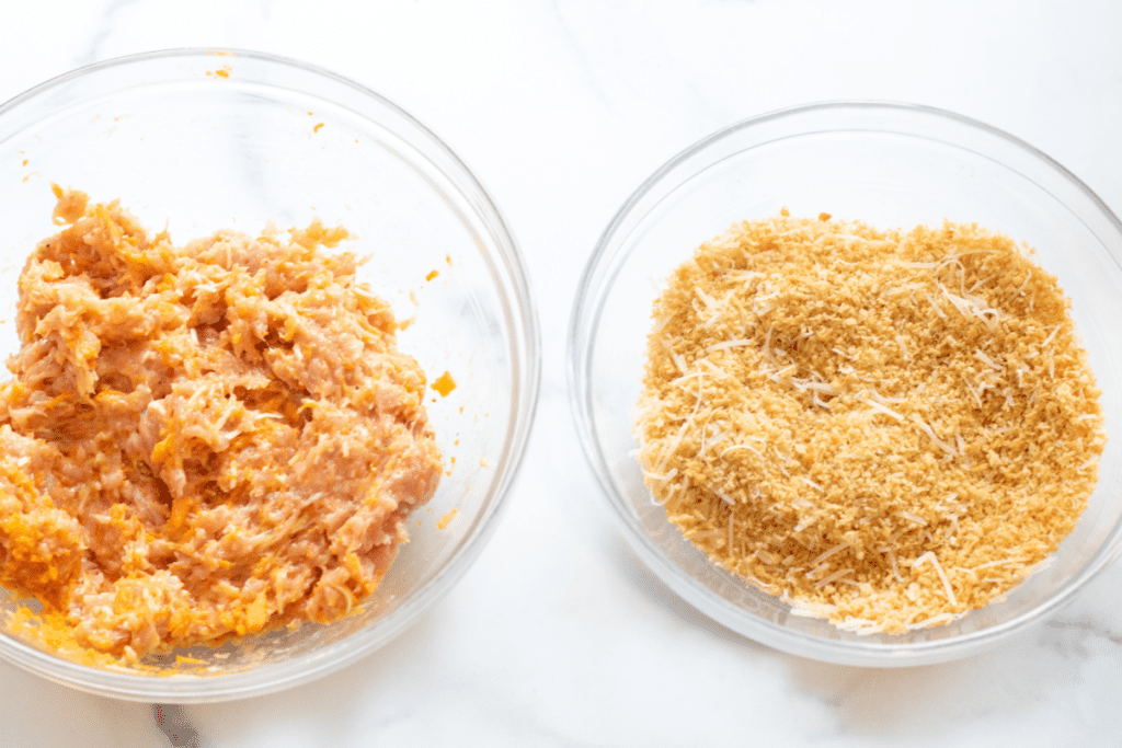 two bowls, one with mixed ground chicken and one  with toasted bread crumbs.