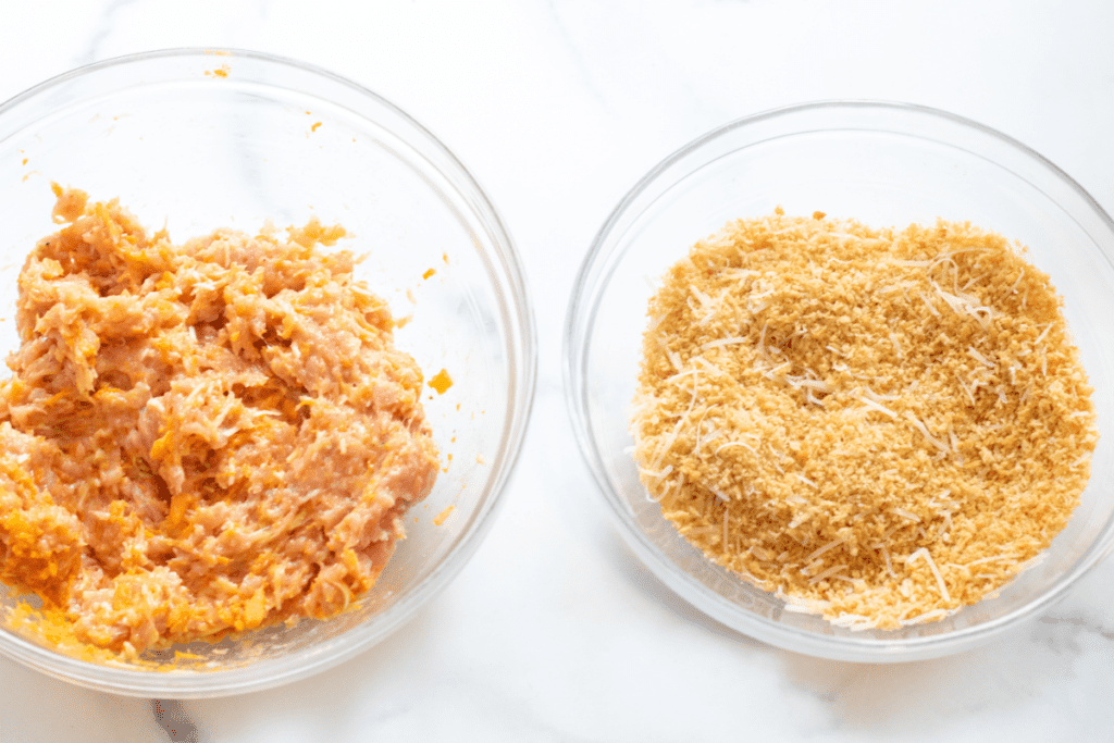 two bowls, one with mixed ground chicken and one with toasted bread crumbs.