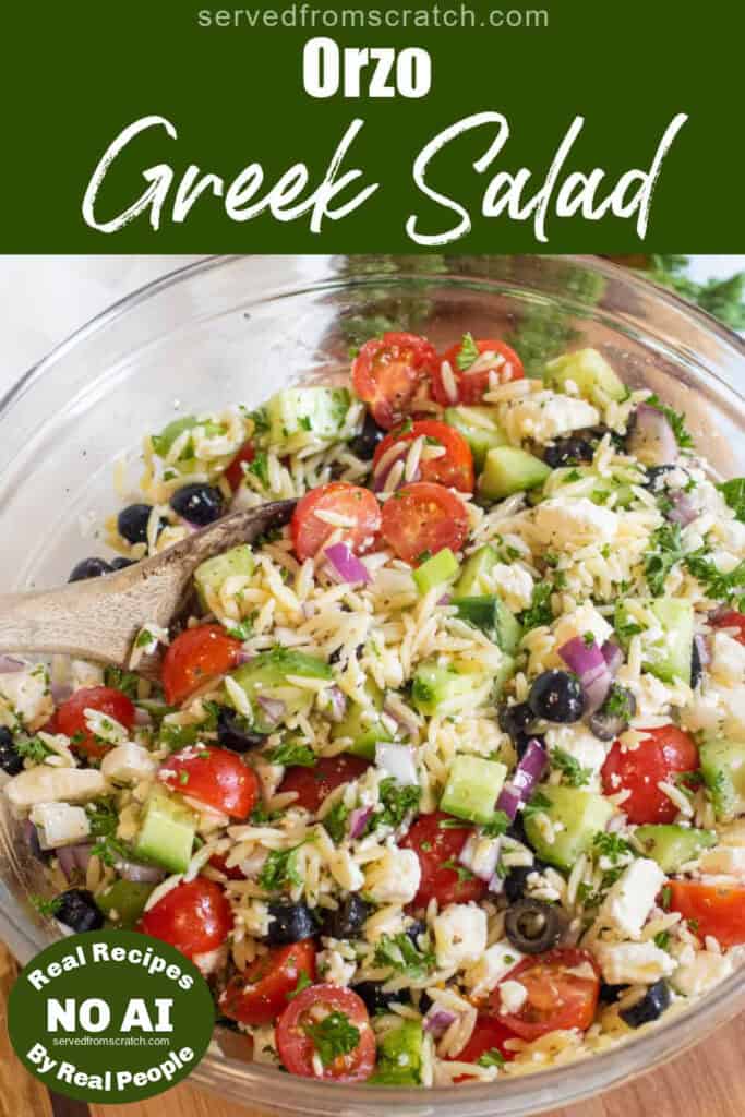 a large bowl of olives, cucumbers, tomatoes, orzo, feta with Pinterest pin text with NO AI sticker.