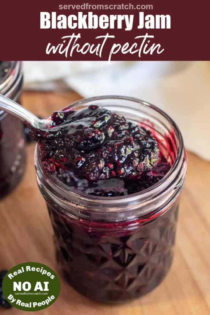 a jar of open blackberry jam with a spoon of jam with Pinterest pin text with NO AI sticker.