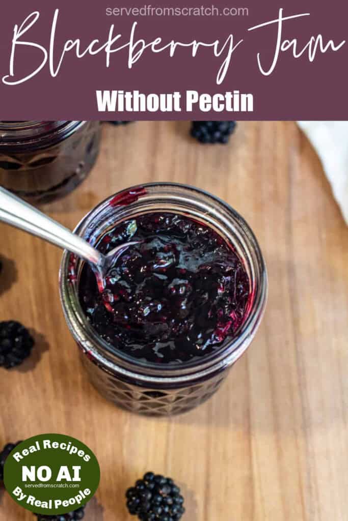 a jar of open blackberry jam with a spoon of jam with Pinterest pin text with NO AI sticker.