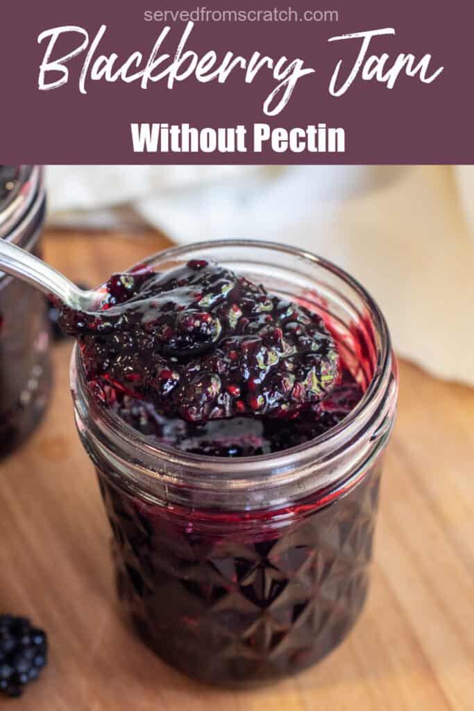 a jar of open blackberry jam with a spoon of jam with Pinterest pin text.