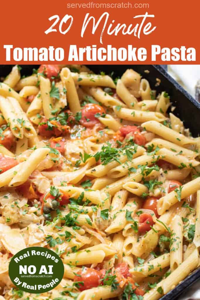 a cast iron of penne pasta with tomatoes and artichokes and parsley with Pinterest pin text and a NO AI sticker.