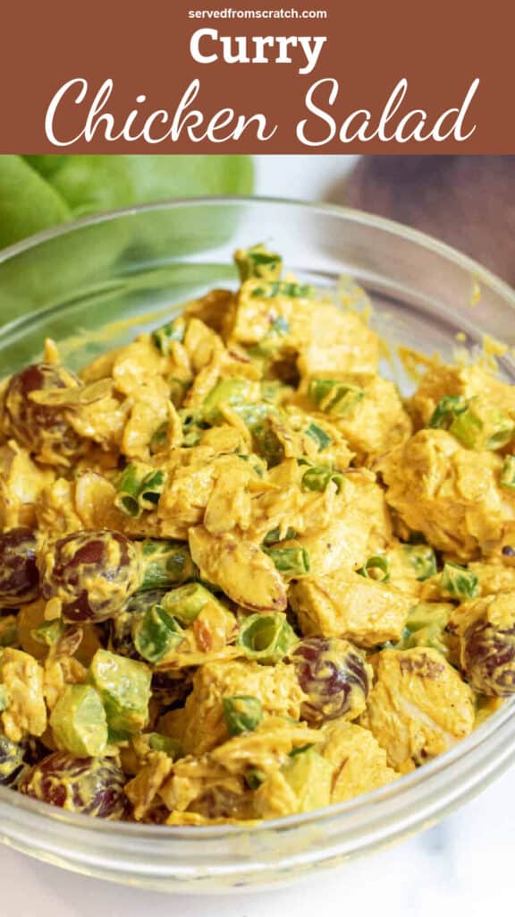 a bowl of curry chicken salad with grapes and green onions with Pinterest pin text.