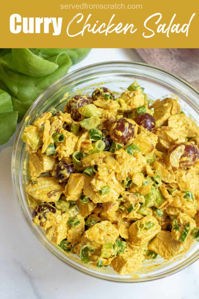 a bowl of curry chicken salad with grapes and green onions with Pinterest pin text.