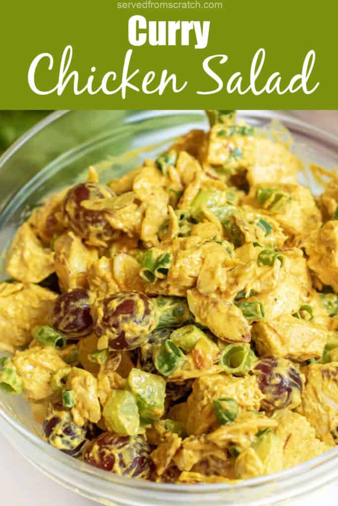 a bowl of curry chicken salad with grapes and green onions with Pinterest pin text.