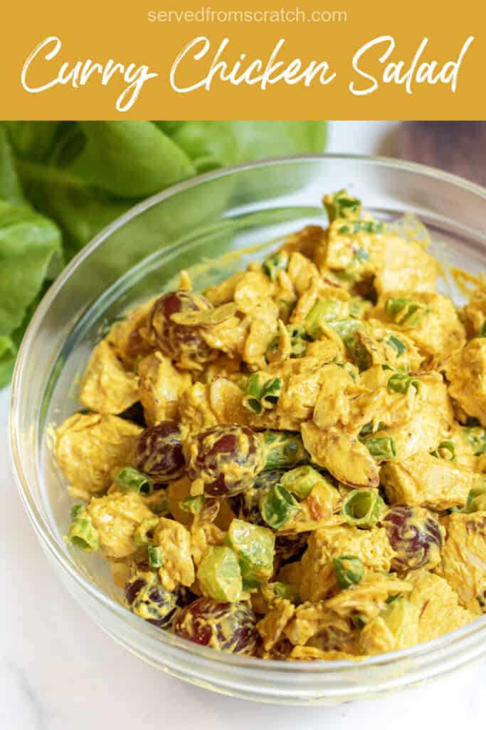 a bowl of curry chicken salad with grapes and green onions with Pinterest pin text.