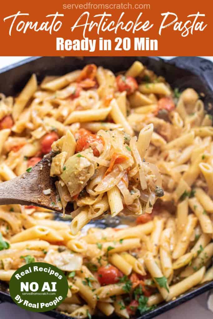 a cast iron of penne pasta with tomatoes and artichokes and parsley with a wooden spoon with PInterest pin text and a NO AI sticker.