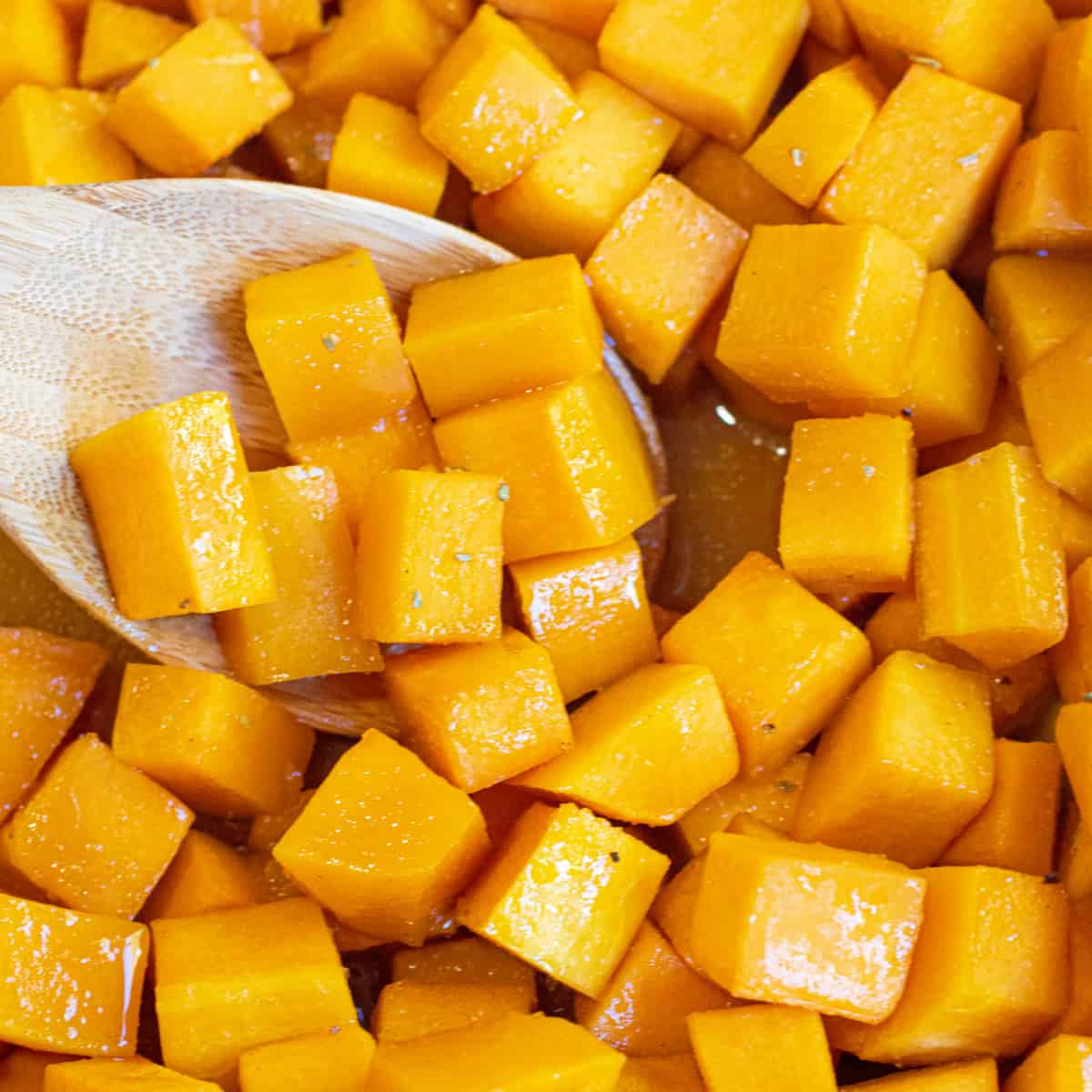 a spoon of butternut squash cooked and cubed.