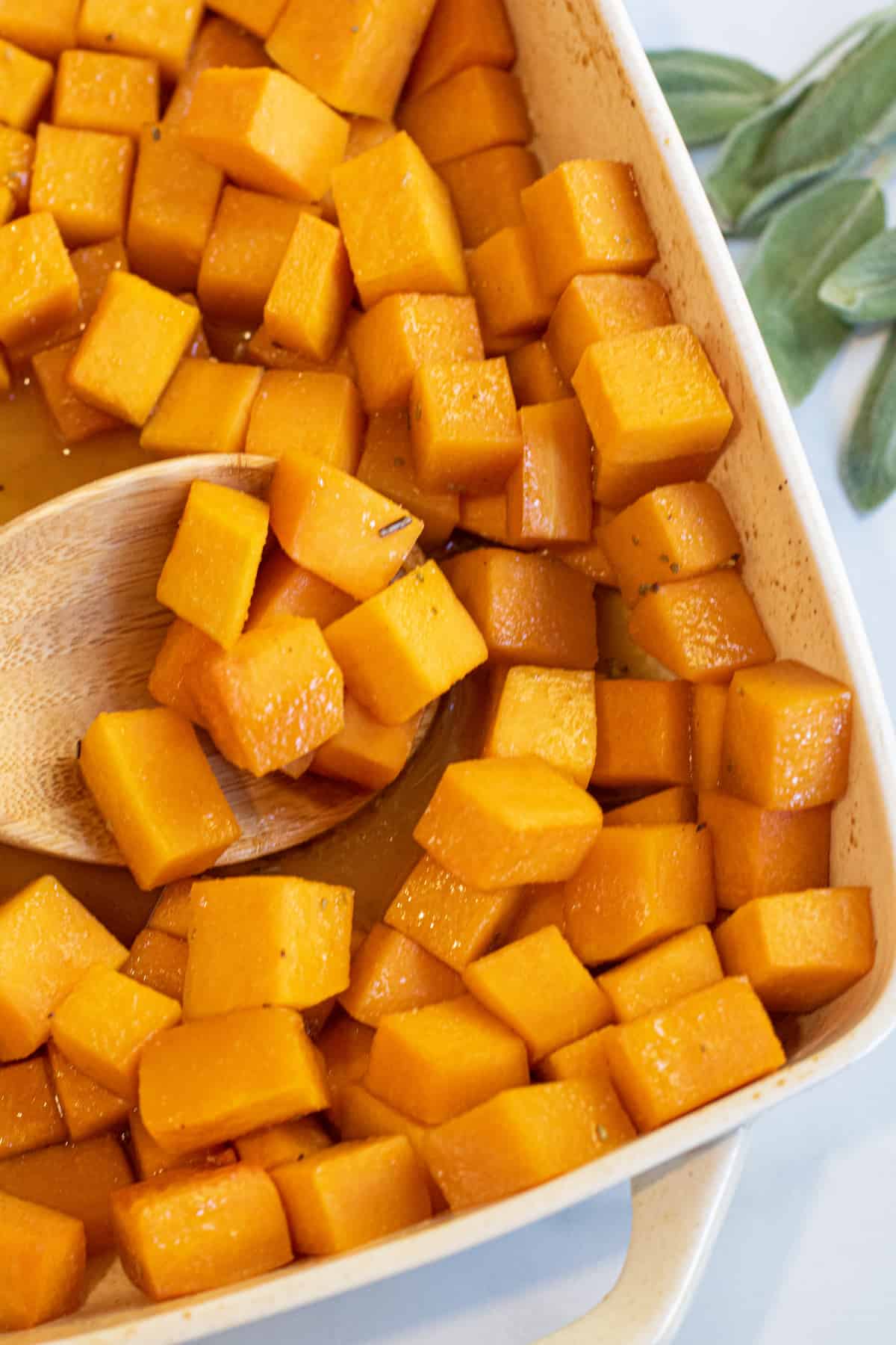 a spoon of butternut squash cooked and cubed.