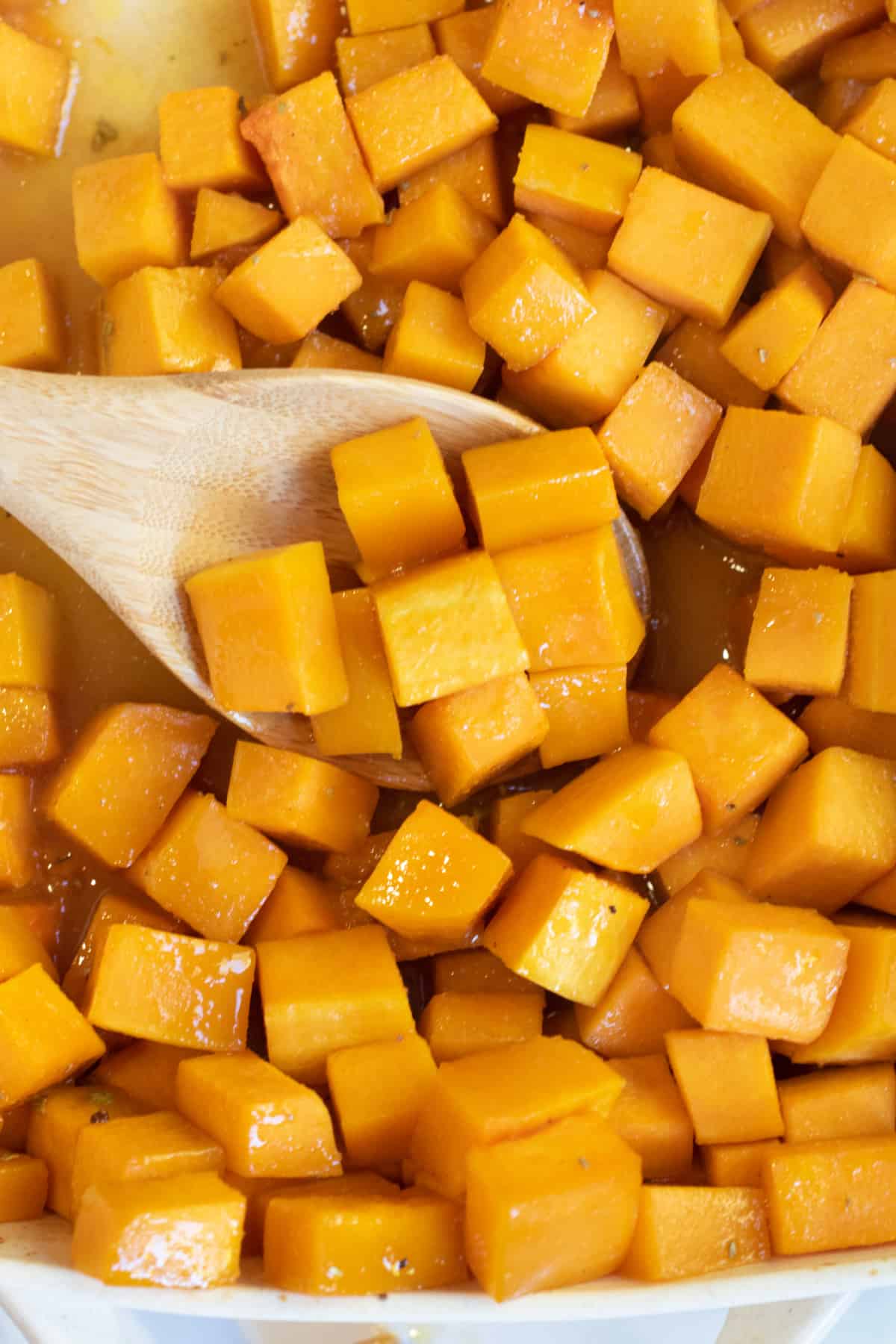 a spoon of butternut squash cooked and cubed.