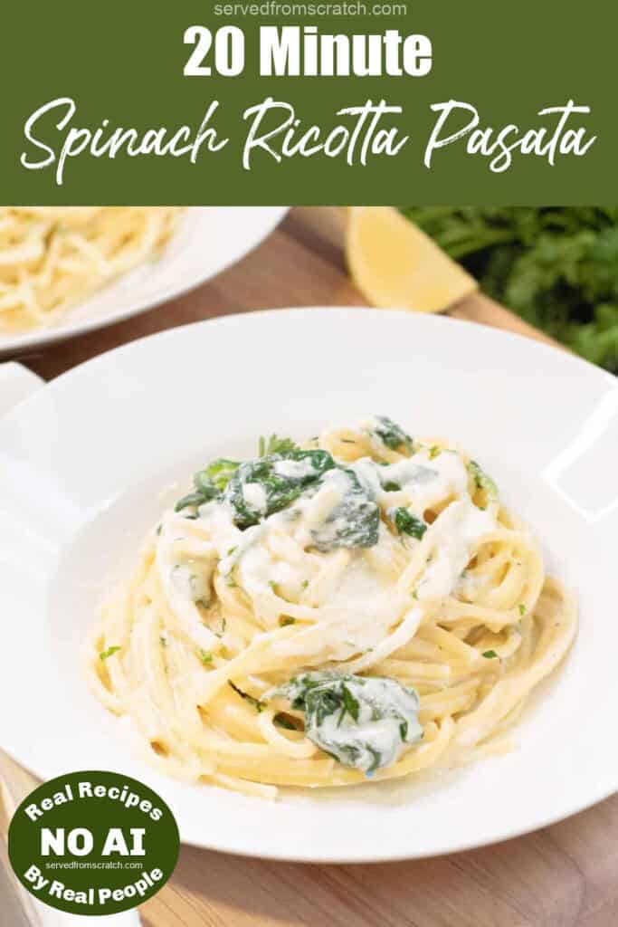 a plate with creamy pasta and spinach with Pinterest pin text with NO AI sticker.