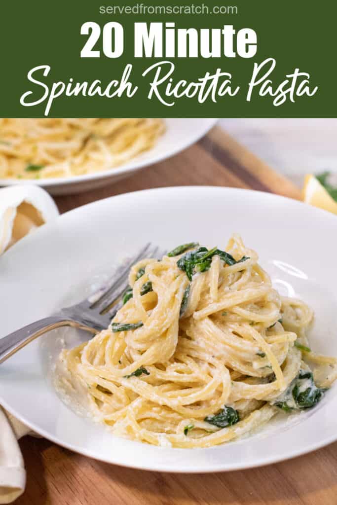 a plate with creamy pasta and spinach with Pinterest pin text.