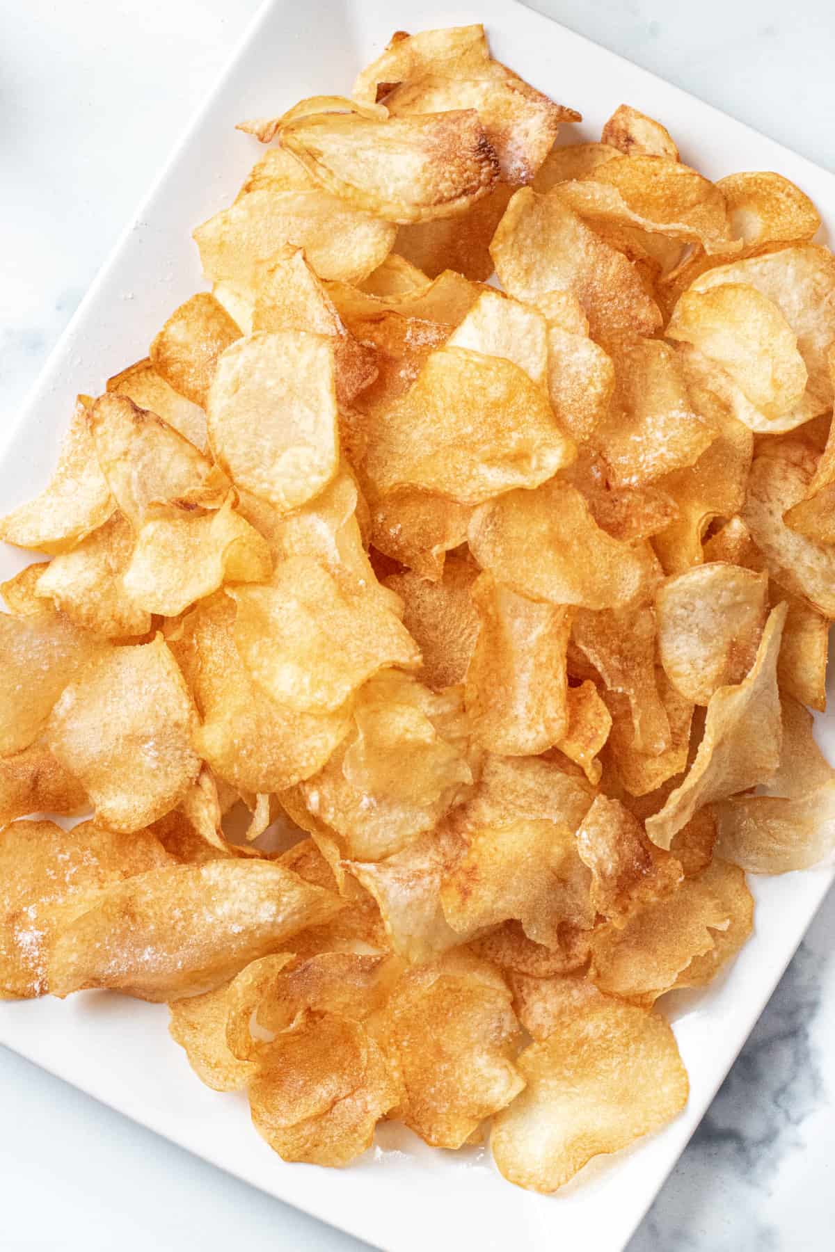 an overhead of a plate of crispy chips.