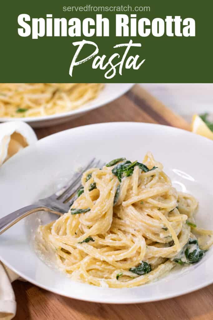 a plate with creamy pasta and spinach with Pinterest pin text.