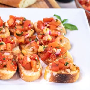 a plate of tomato bruschetta.