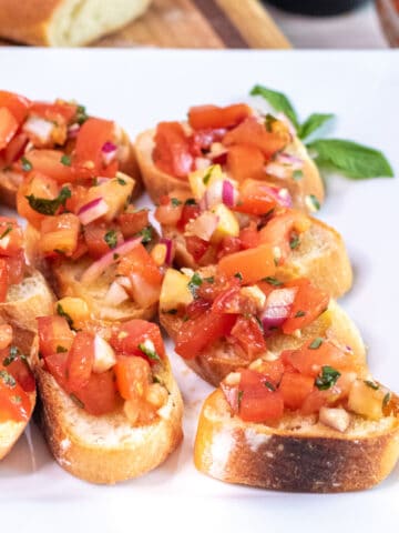 a plate of tomato bruschetta.