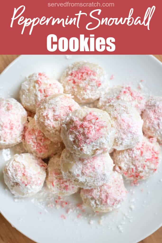 an overhead of a plate of stacked snowball cookies with crushed candy cane on top with Pinterest pin text.