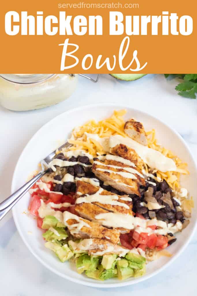 an overhead of a bowl of rice, cheese, avocado, tomatoes, black beans, chicken, and sauce with Pinterest pin text.