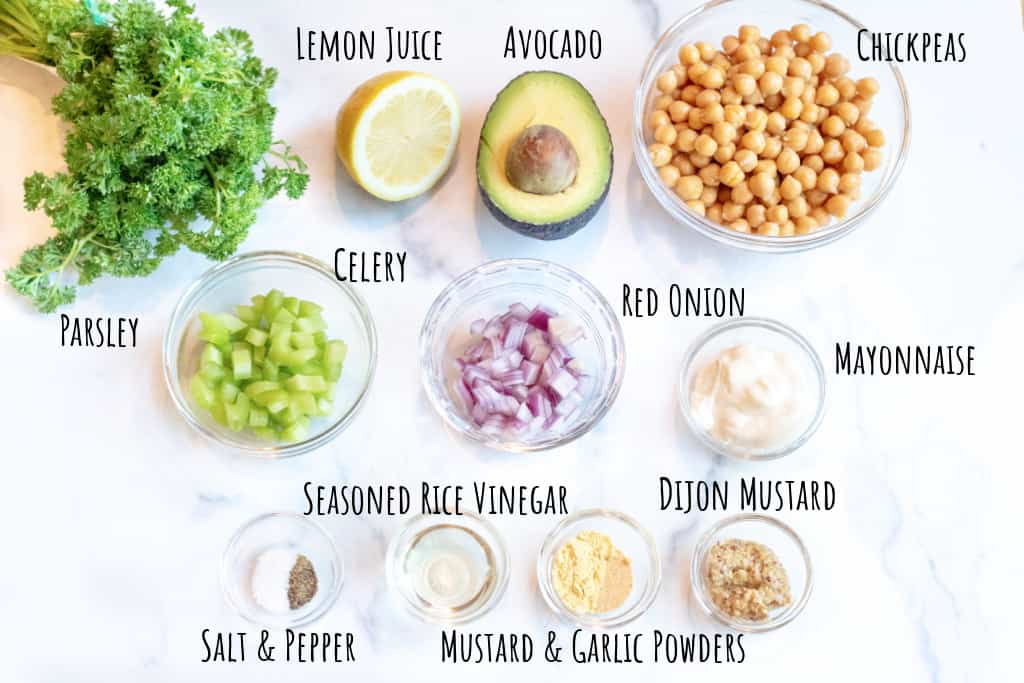 parsley, lemon, avocado, chickpeas, a bowl of celery, onion, mayo, and spices.