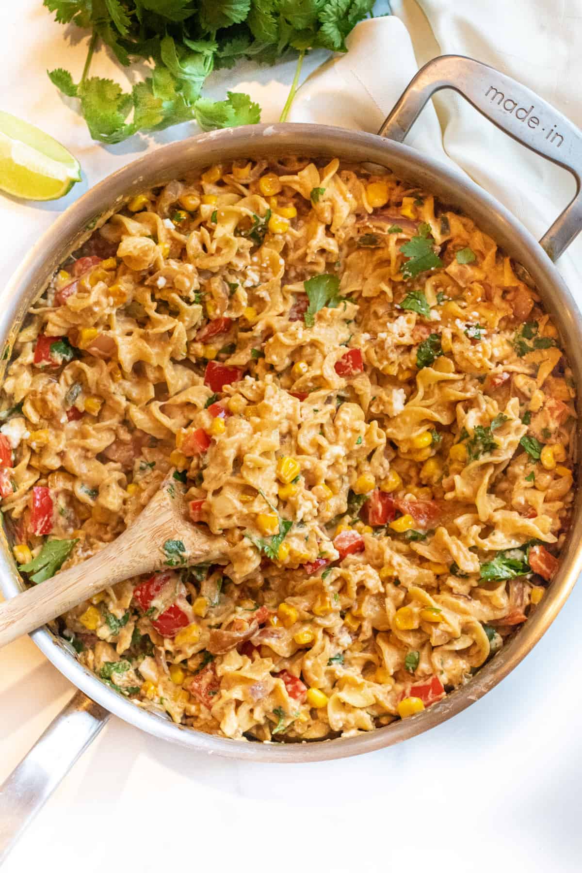 an overhead shot of a creamy pasta with a spoon.