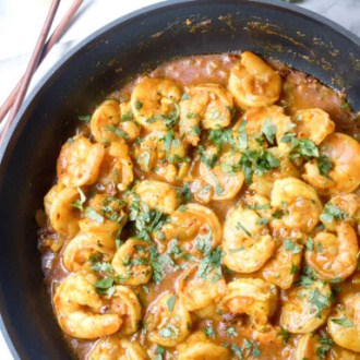 an overhead of a pan of shrimp curry.