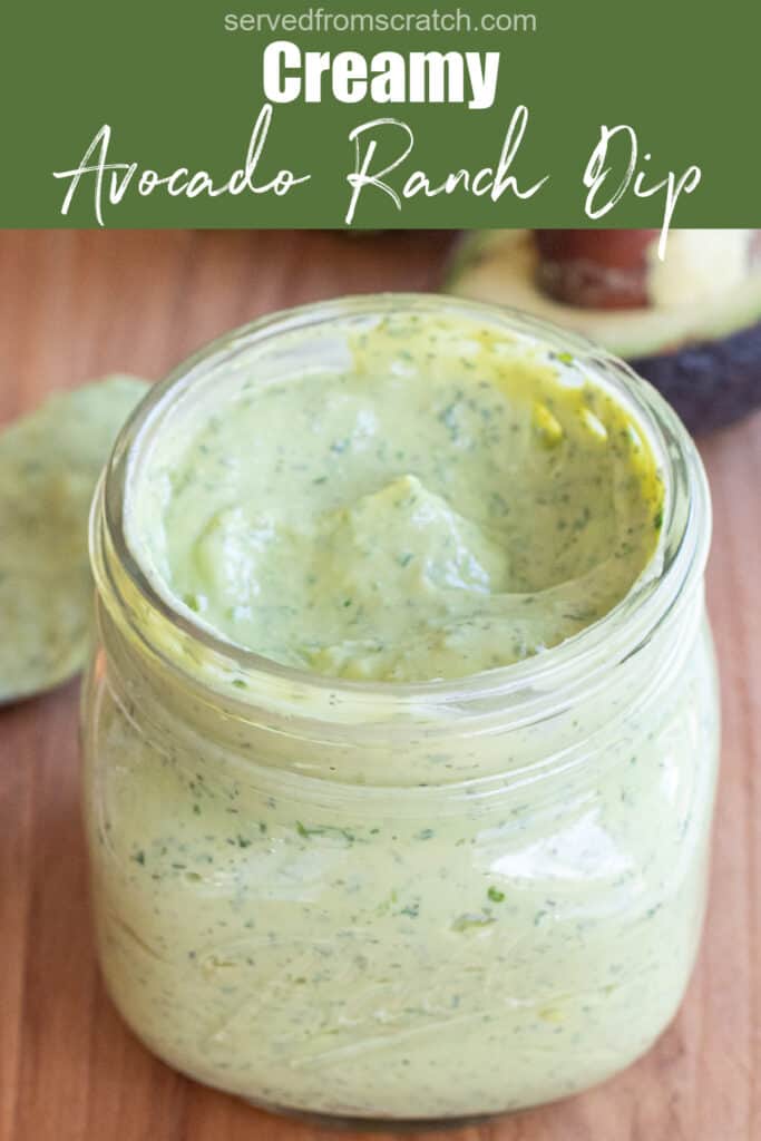 an open mason jar of a green creamy dressing with Pinterest pin text.