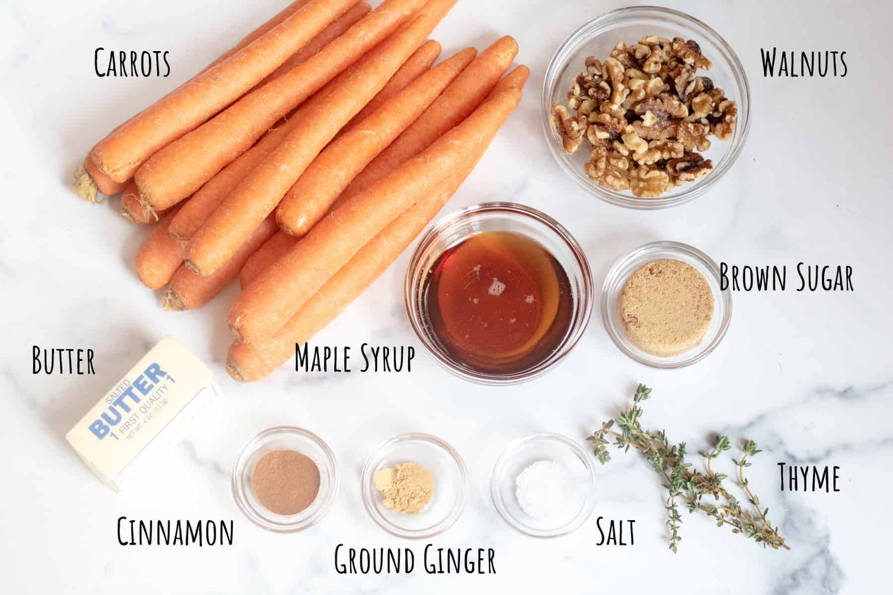 carrots, walnuts, butter, maple syrup, sugar, cinnamon, ginger, salt, and thyme.