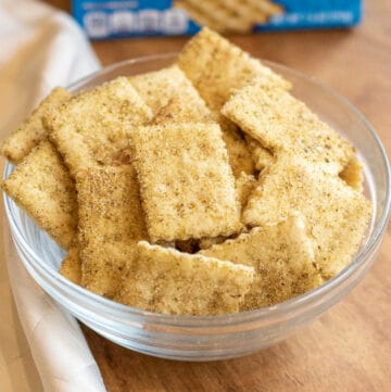 a bowl of crackers in front of a blue box.