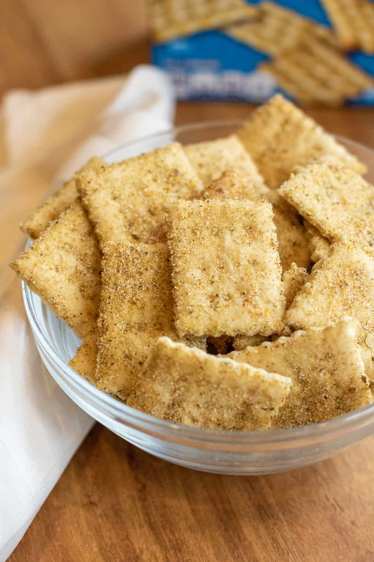 a bowl of crackers in front of a blue box.