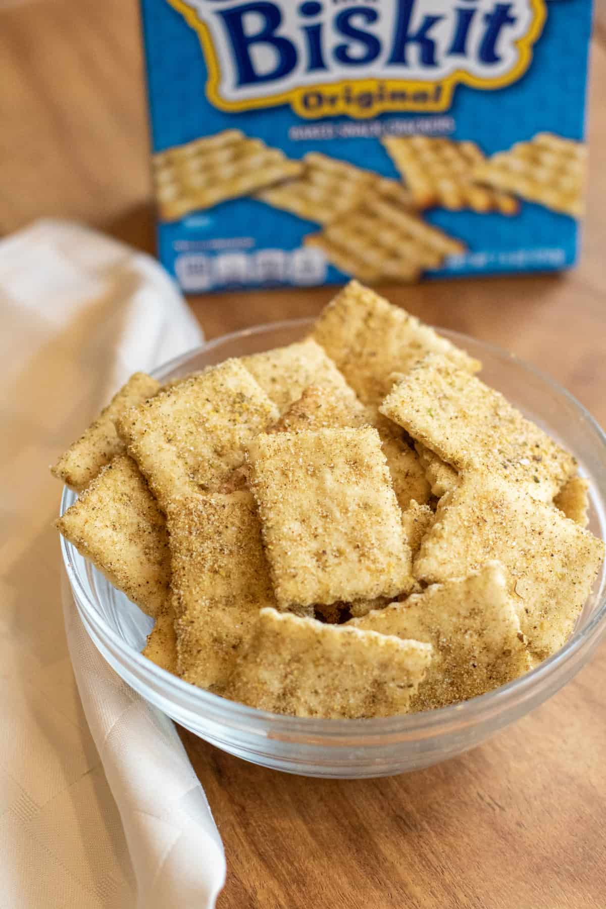 a bowl of crackers in front of a blue box.