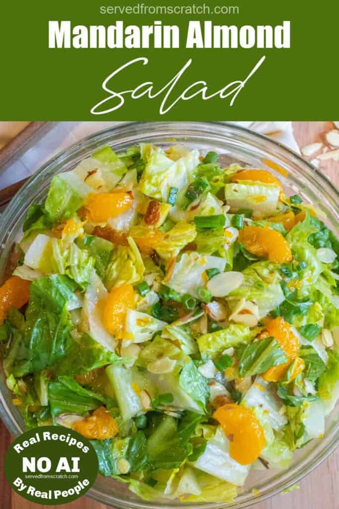 an overhead shot of a bowl of romaine lettuce salad with mandarins and almonds with Pinterest pin text and NO AI sticker.