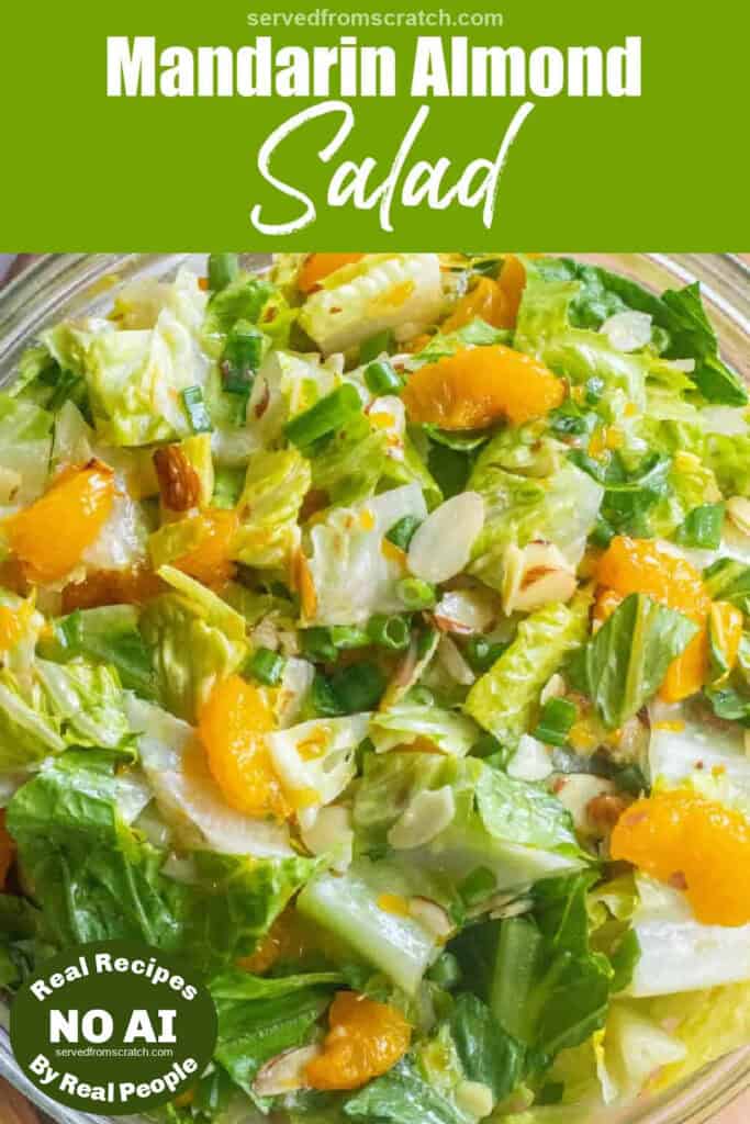an overhead shot of a bowl of romaine lettuce salad with mandarins and almonds with Pinterest pin text and NO AI sticker.