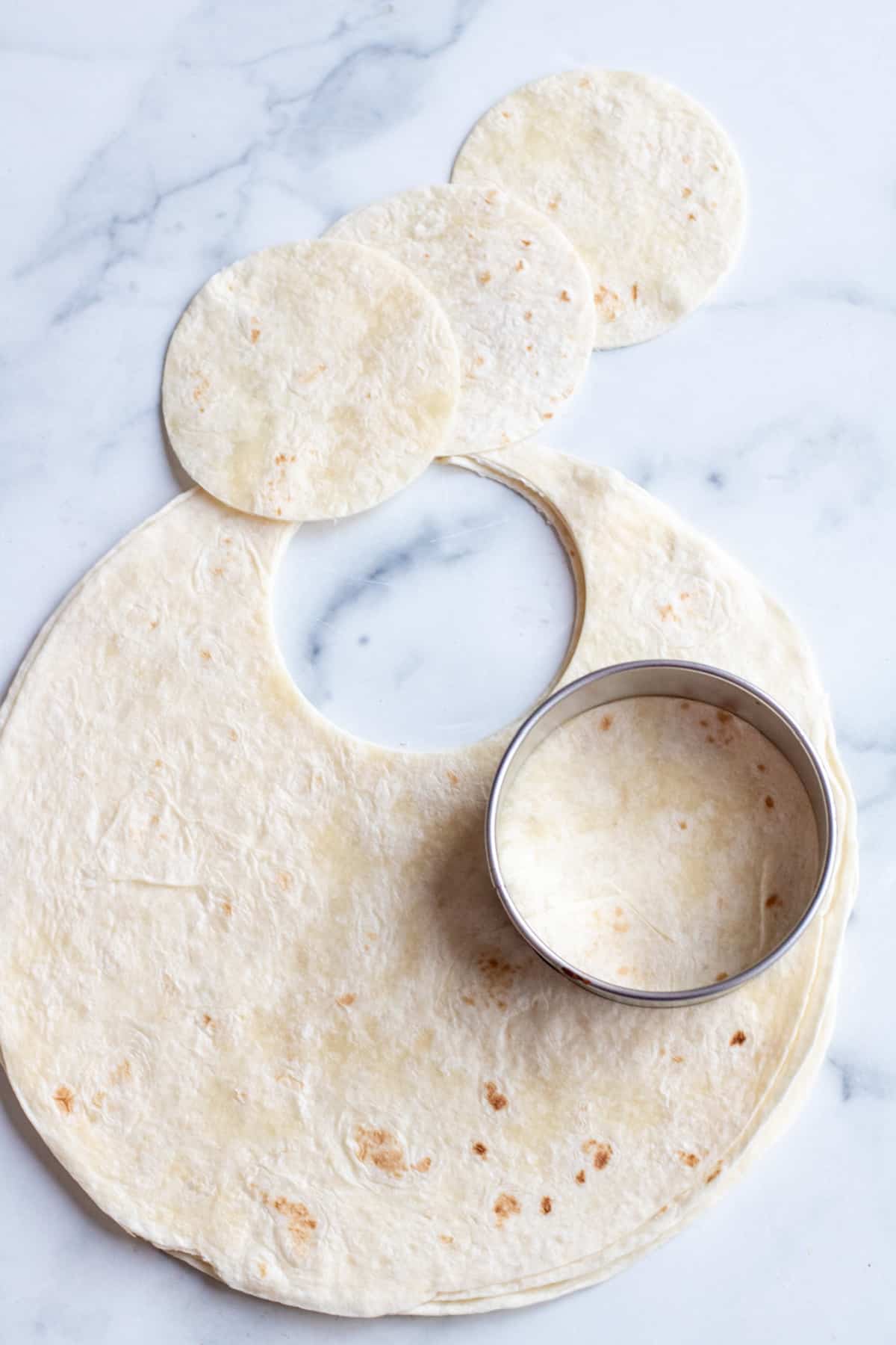 large burrito tortillas with big circles cut out. 