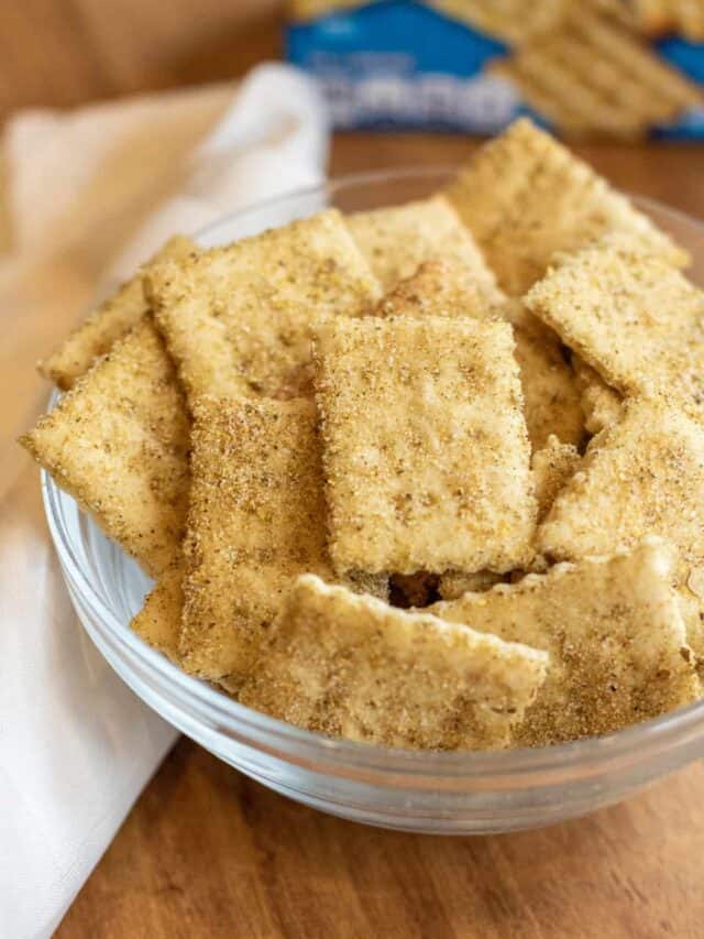 a bowl of crackers in front of a blue box.