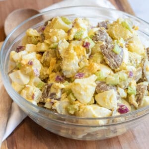 a large bowl of creamy potato salad with eggs.