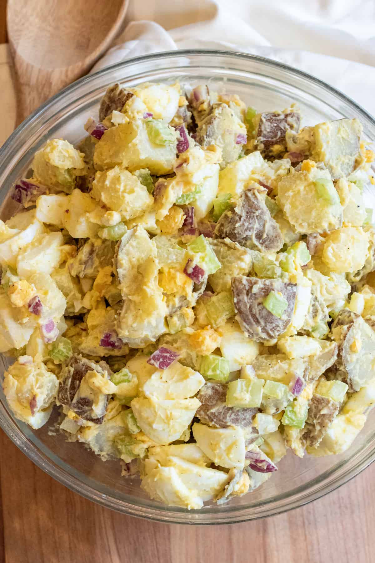 a large bowl of creamy potato salad with eggs.