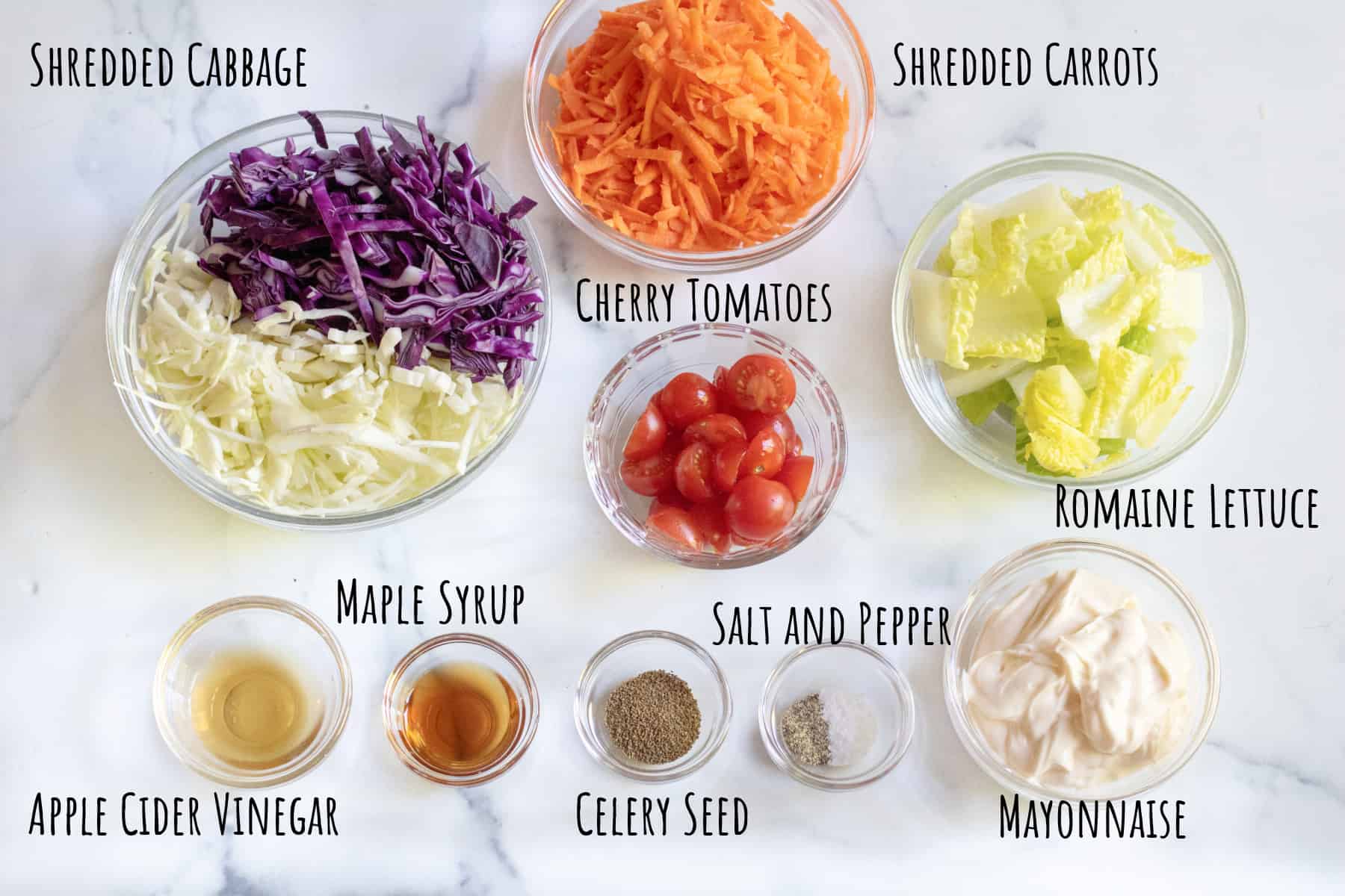cabbage, carrots, lettuce, tomatoes, mayonnaise, spices, and vinegar.