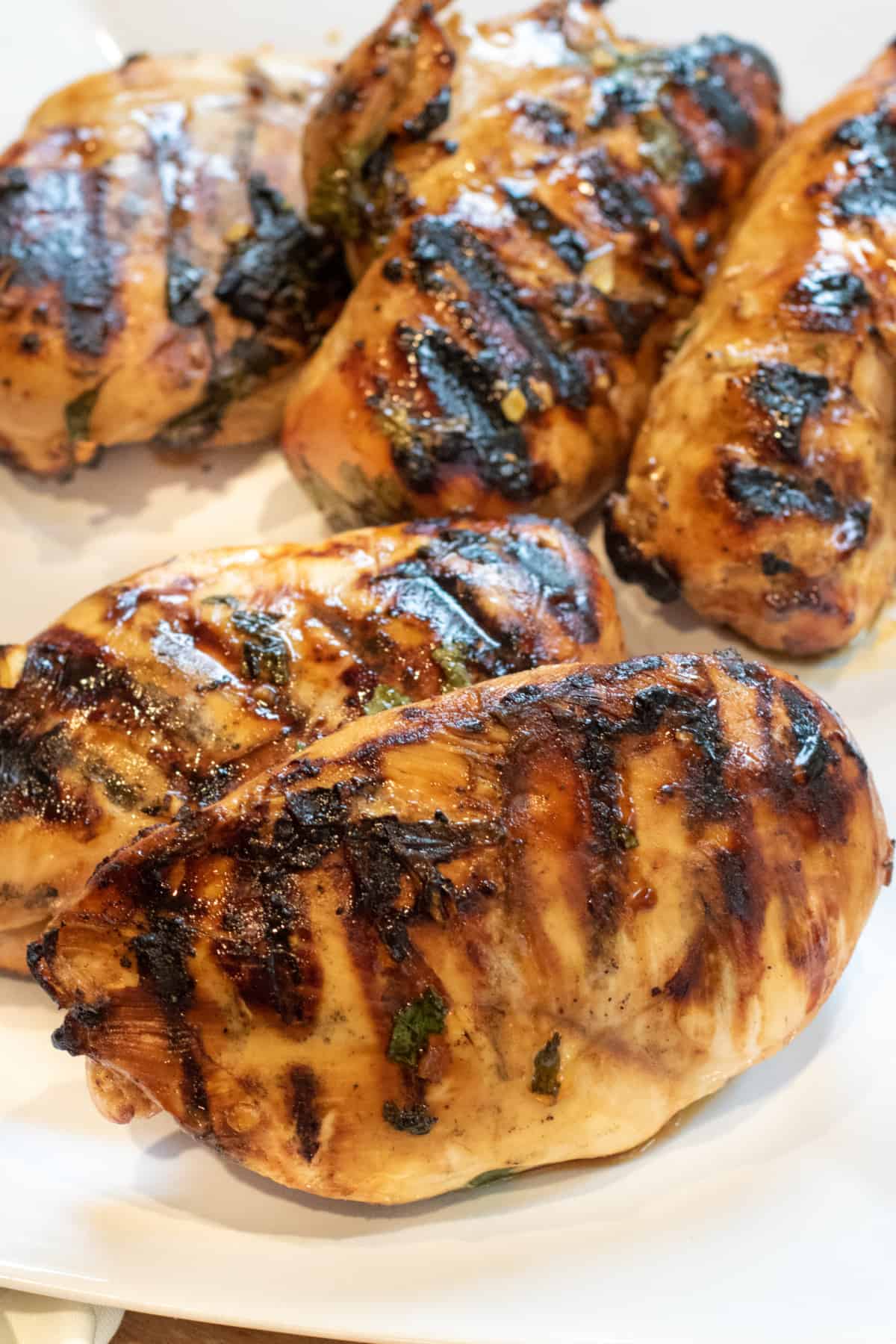 grilled chicken breasts on a plate.