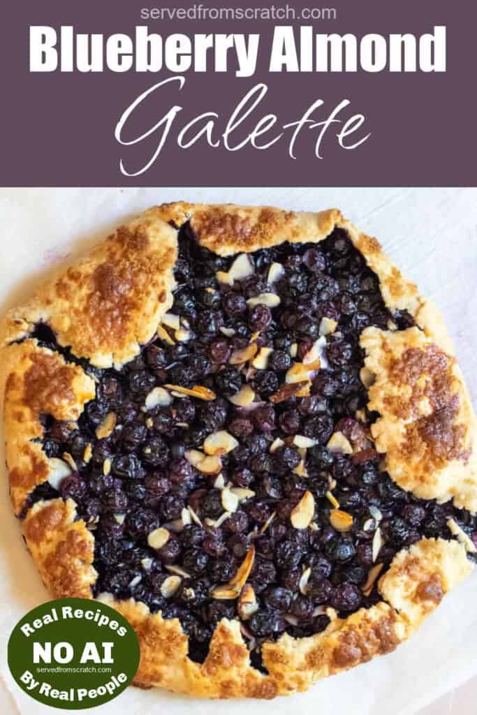 an overhead of a baked blueberry galette with almonds, Pinterest pin text, and NO AI sticker.
